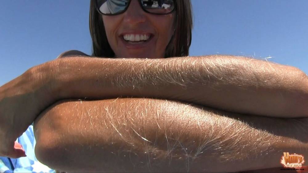 Amateur chick Lori Anderson tugs on her hairy arms in a bikini and shades - #14
