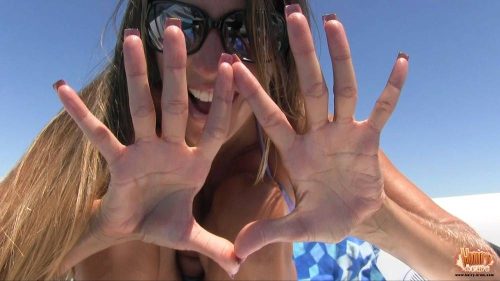 Amateur chick Lori Anderson tugs on her hairy arms in a bikini and shades - #7