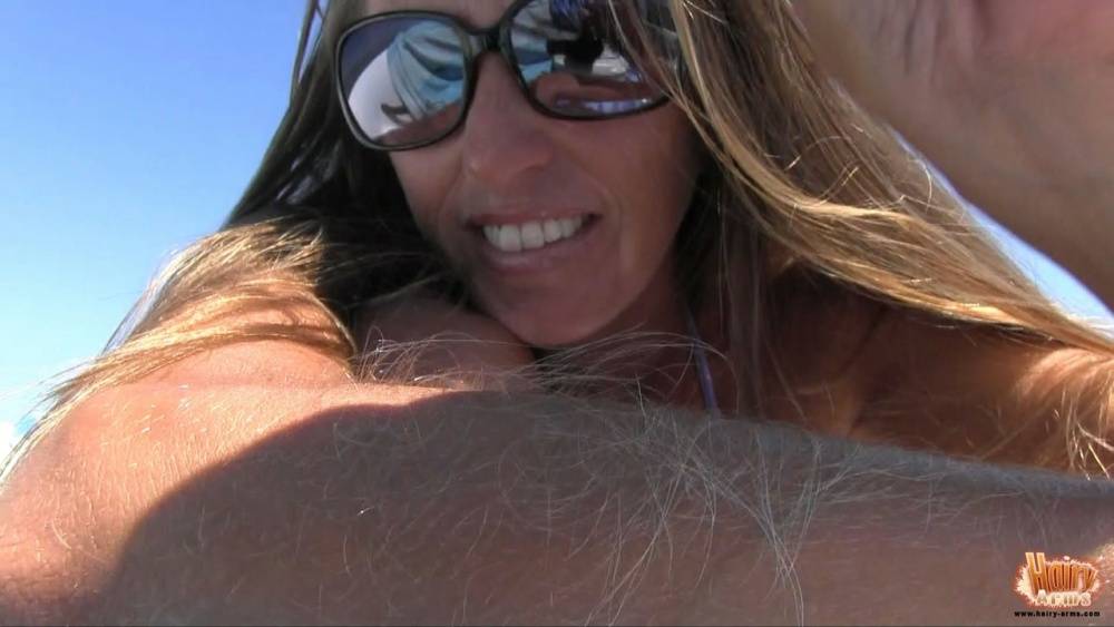 Amateur chick Lori Anderson tugs on her hairy arms in a bikini and shades - #6