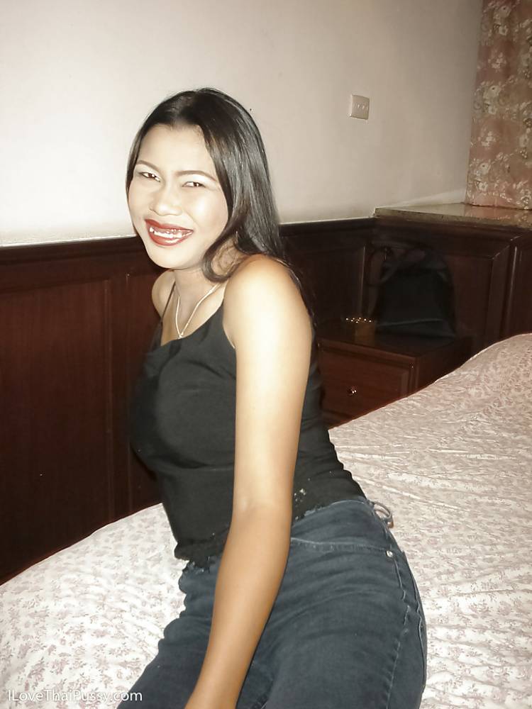 Smiley thai lassie in jeans undressing and posing on the bed - #15