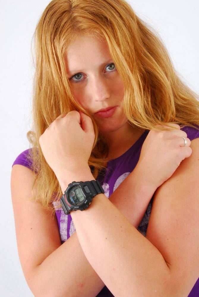 Natural redhead Judy models a black G-Shock watch while fully clothed - #16