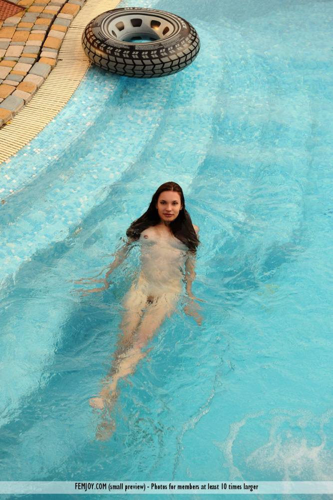 Naked teen Lucie L hits upon great solo poses while in a swimming pool - #3