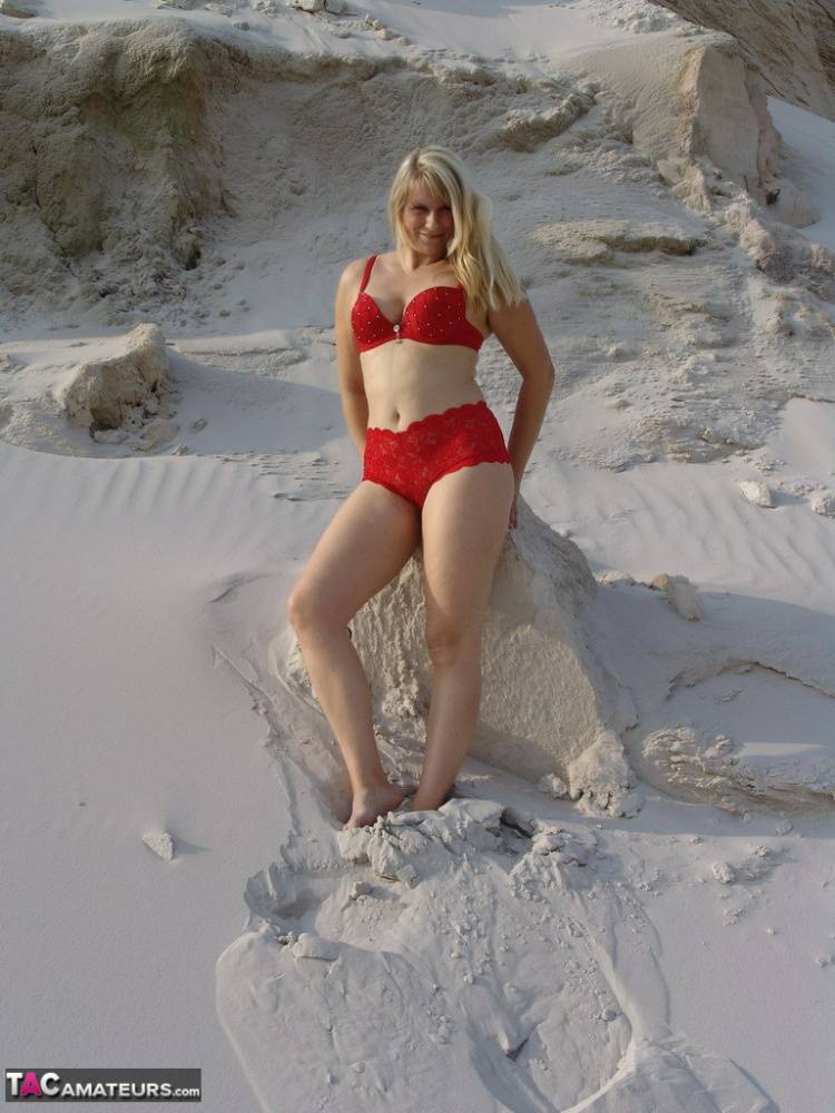 Blonde amateur Sweet Susi gets totally naked on a sandy bank by herself - #13