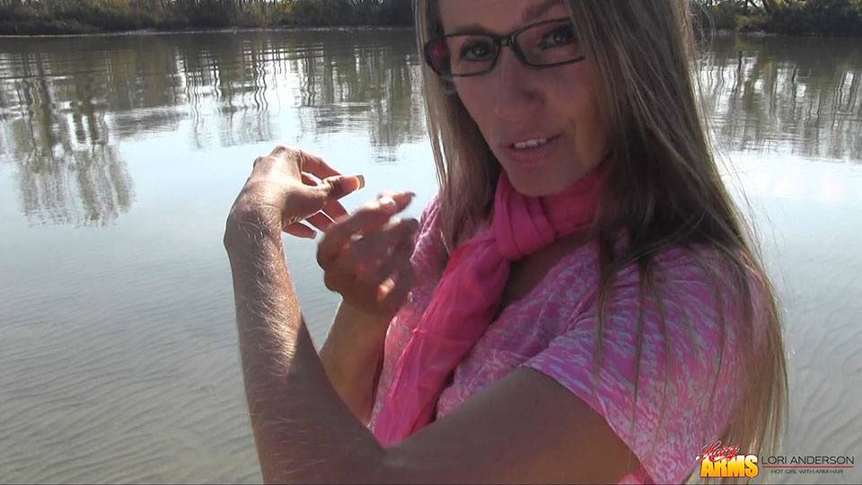 Amateur chick Lori Anderson shows off incredibly hairy forearms by the water - #2