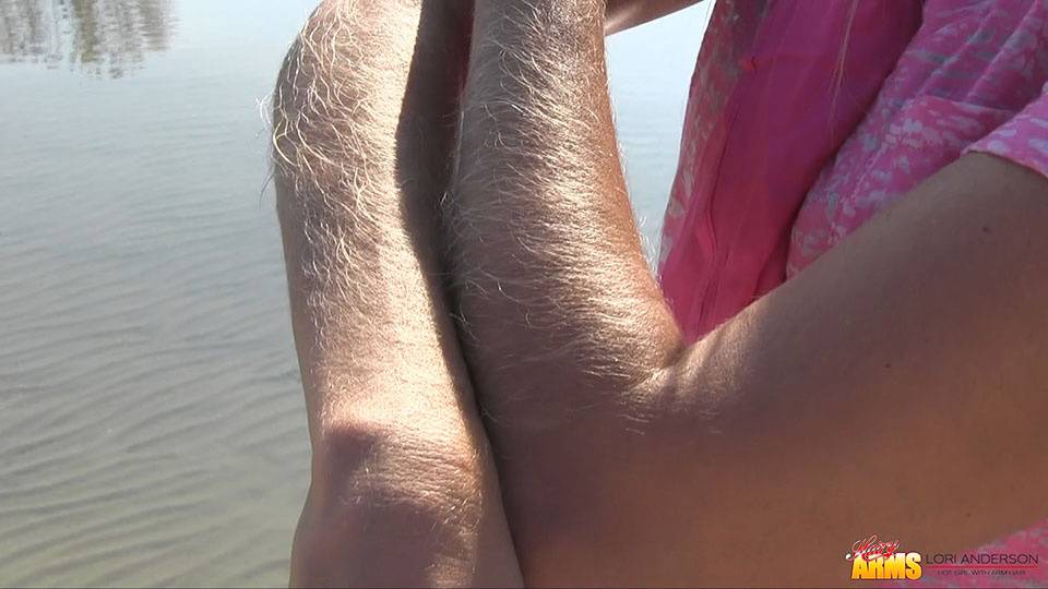 Amateur chick Lori Anderson shows off incredibly hairy forearms by the water - #6