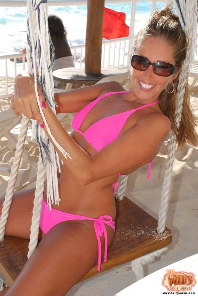 Amateur model Lori Anderson shows her hairy arms in a bikini and sunglasses - #1