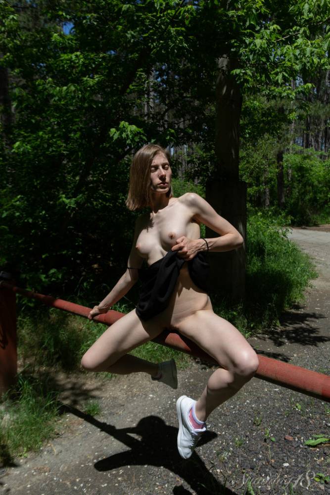 Skinny teen Anna R shows her snatch over a bar on a rural driveway - #6