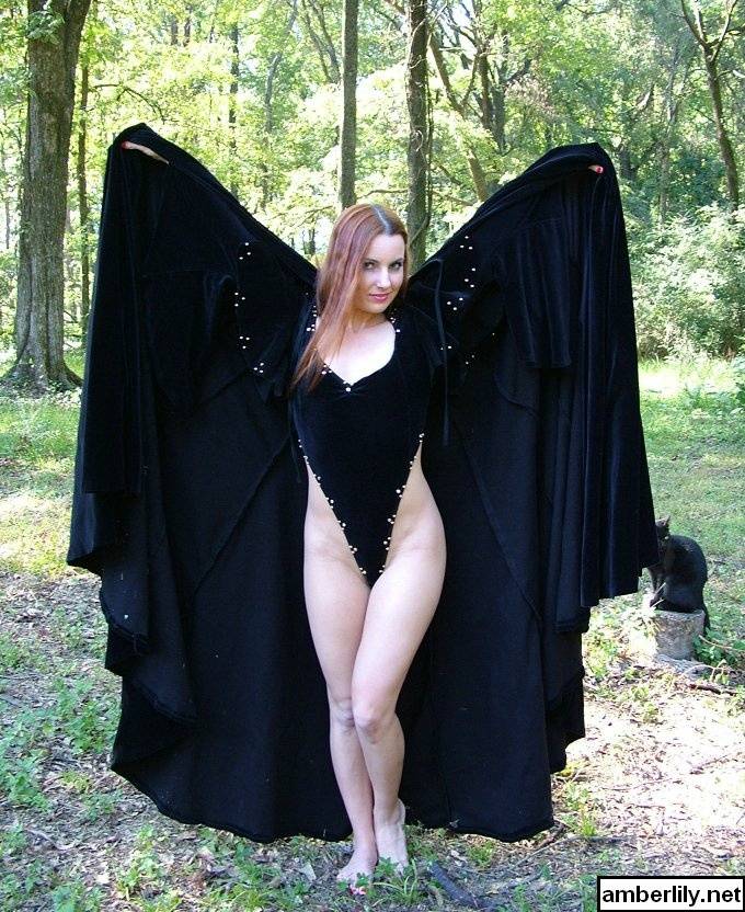 Redhead amateur Amber Lily models nude in a forest draped in a black cape - #5