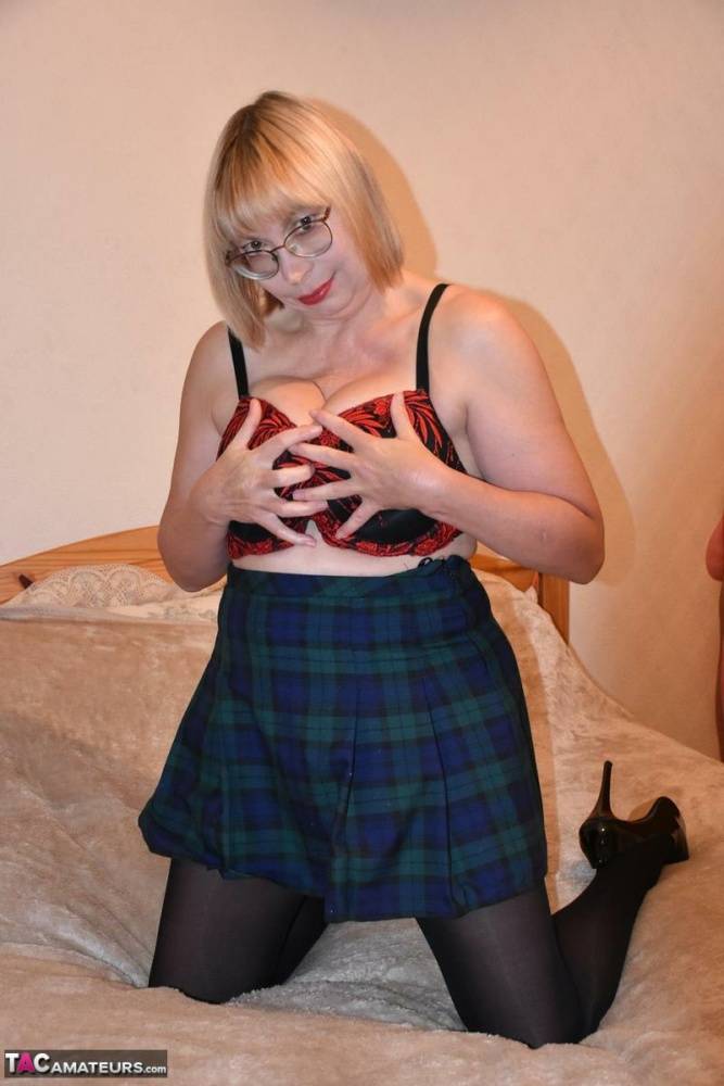 Mature blonde Barby Slut pulls down her hose after removing schoolgirl clothes - #2