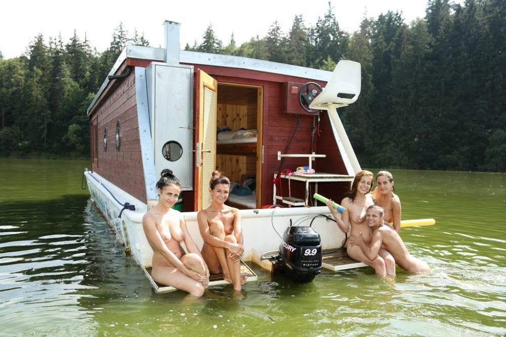 A group of teenage girls go rafting on a river in the nude - #1