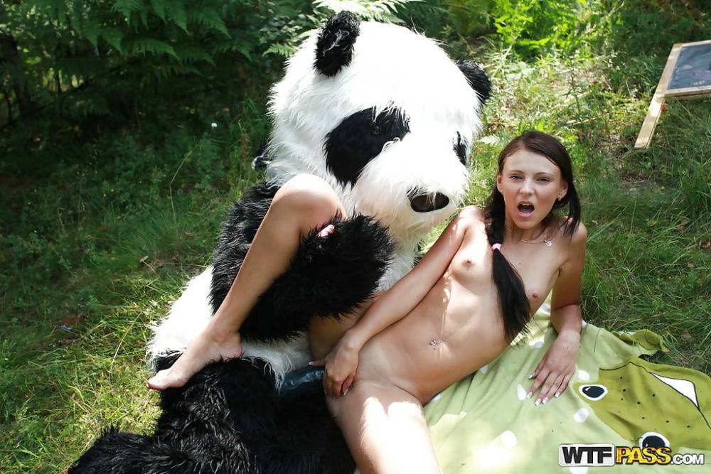 Naughty teen cutie with svelte body have some fun with a panda toy outdoor - #7