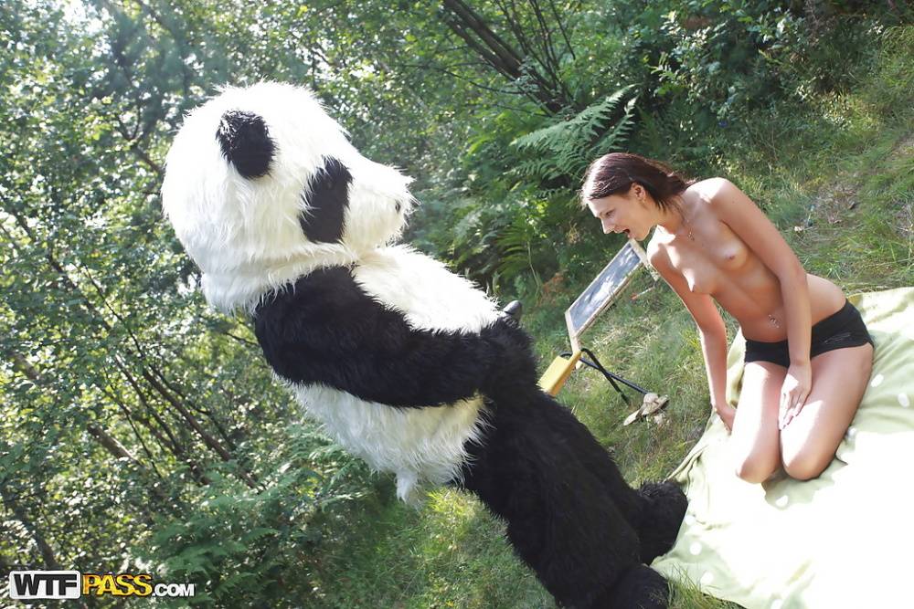 Naughty teen cutie with svelte body have some fun with a panda toy outdoor - #10