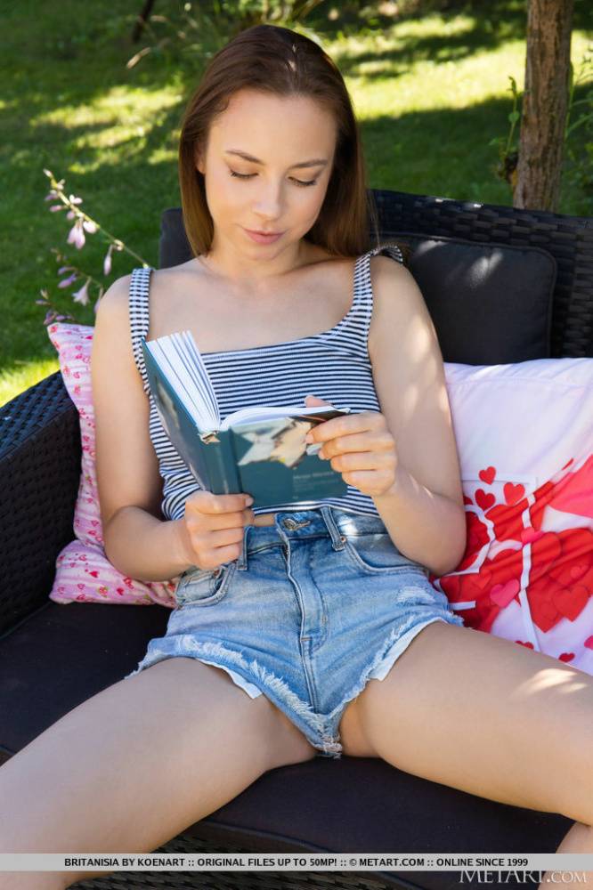 Charming young girl Britanisia gets naked while reading a book in the backyard - #16