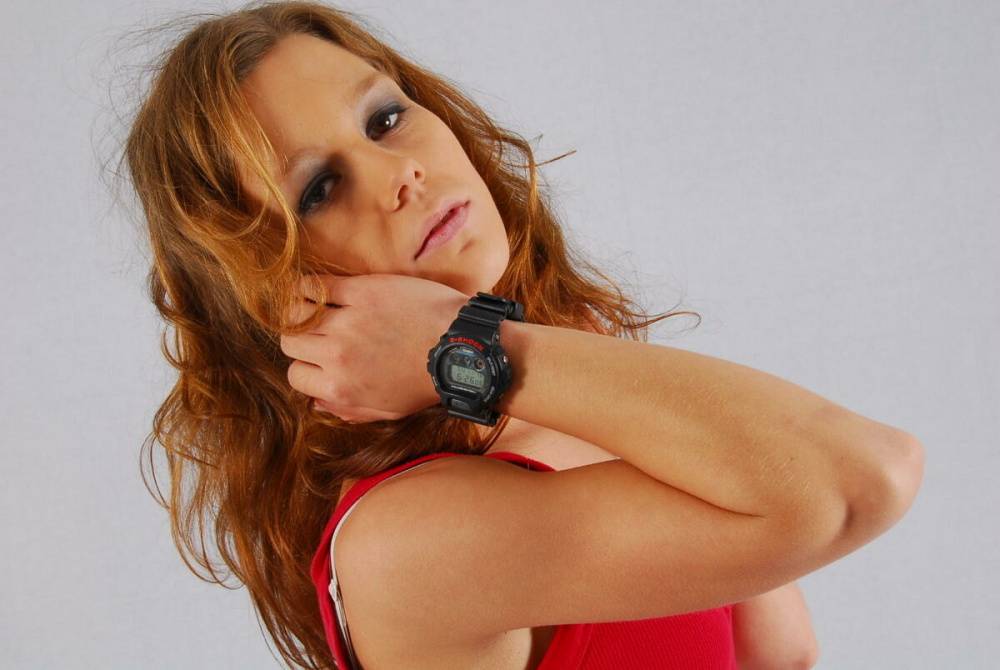 Natural redhead Sabine shows off her black G-shock watch while fully clothed - #2