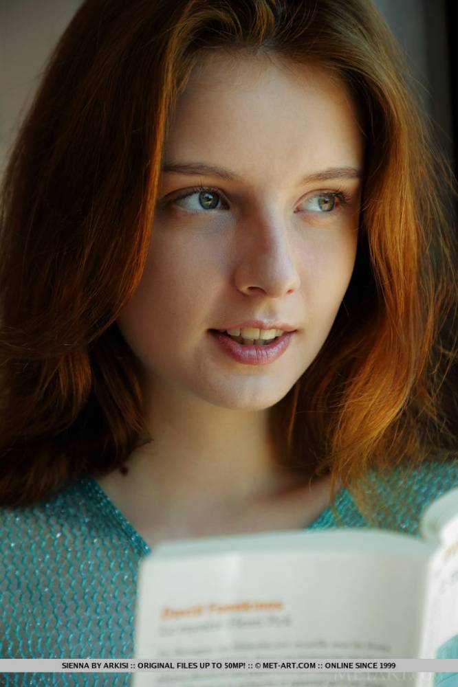 Young redhead Sienna gets totally naked on her bed after reading a book - #4