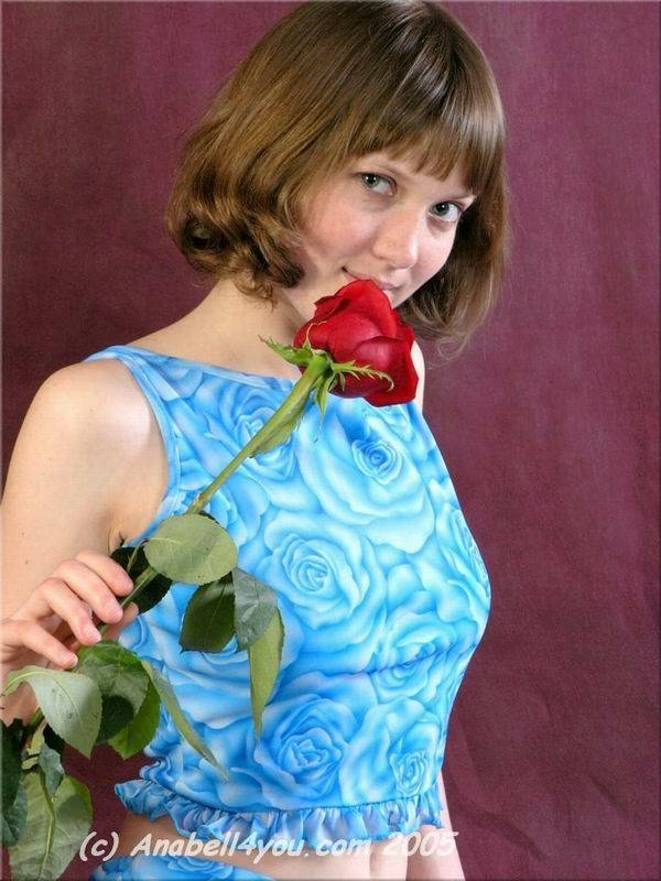 Charming teen Anabell holds a solitary red rose while taking off her clothes - #13