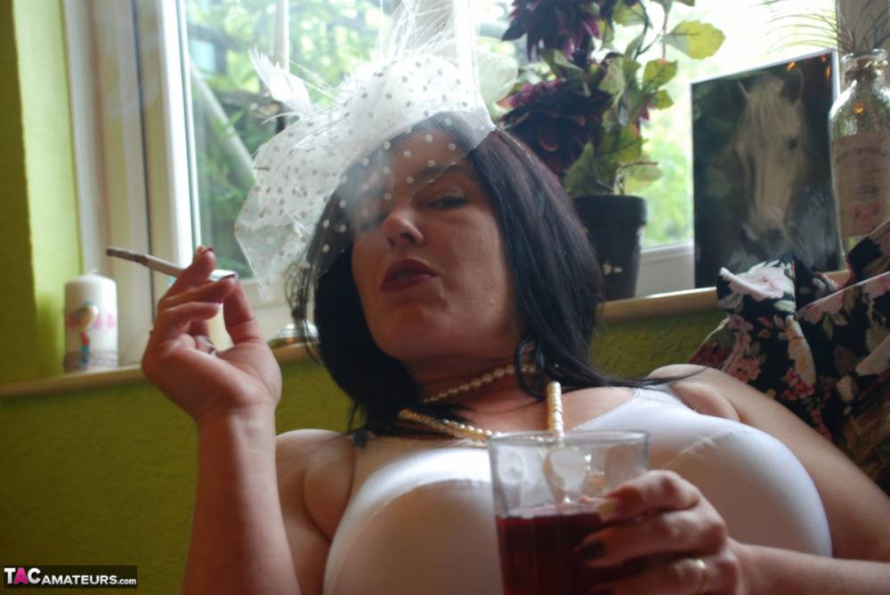 Older British amateur Juicey Janey exposes her bush while smoking & drinking - #2