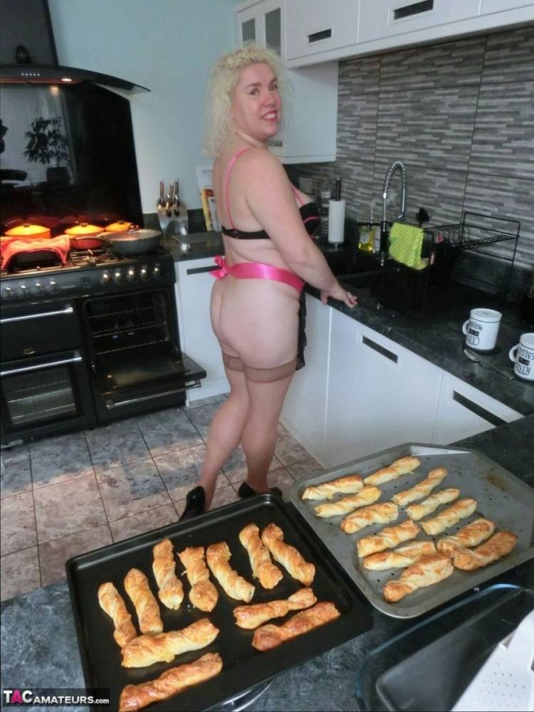 Aged blonde Barby removes lingerie to get naked in tan stockings while cooking - #5