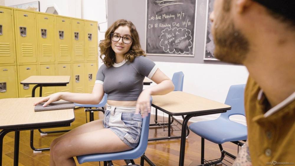 Cute young girl wears her glasses while giving a topless BJ in a classroom - #13