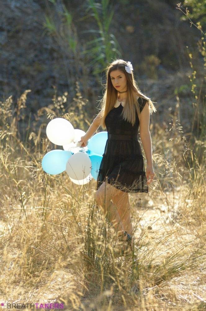 Beautiful girl Stella Cox holds a bunch of balloons after getting nude outside - #6