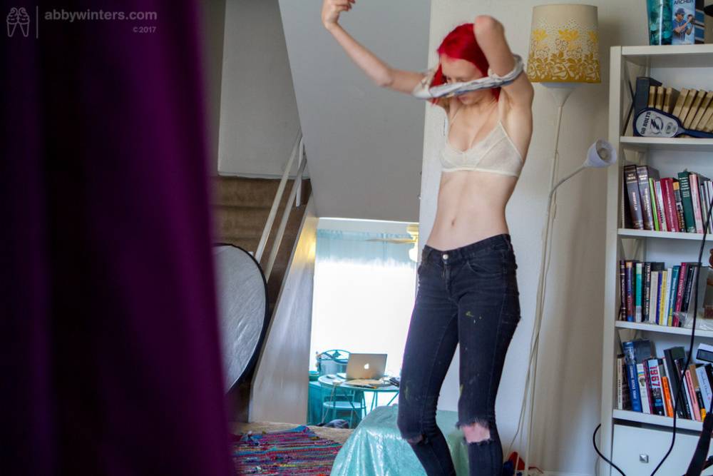 Nude amateur redhead Elizabeth M gets dressed while a hidden spy cam rolls - #9