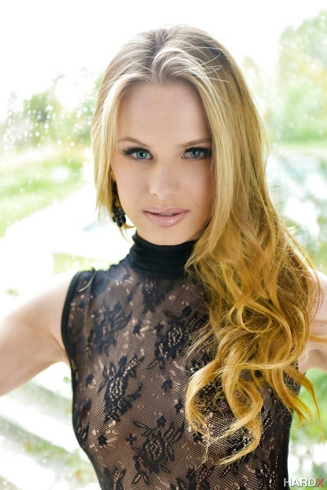 Blonde babe model Jillian Janson strutting outdoors in black bodystocking - #6