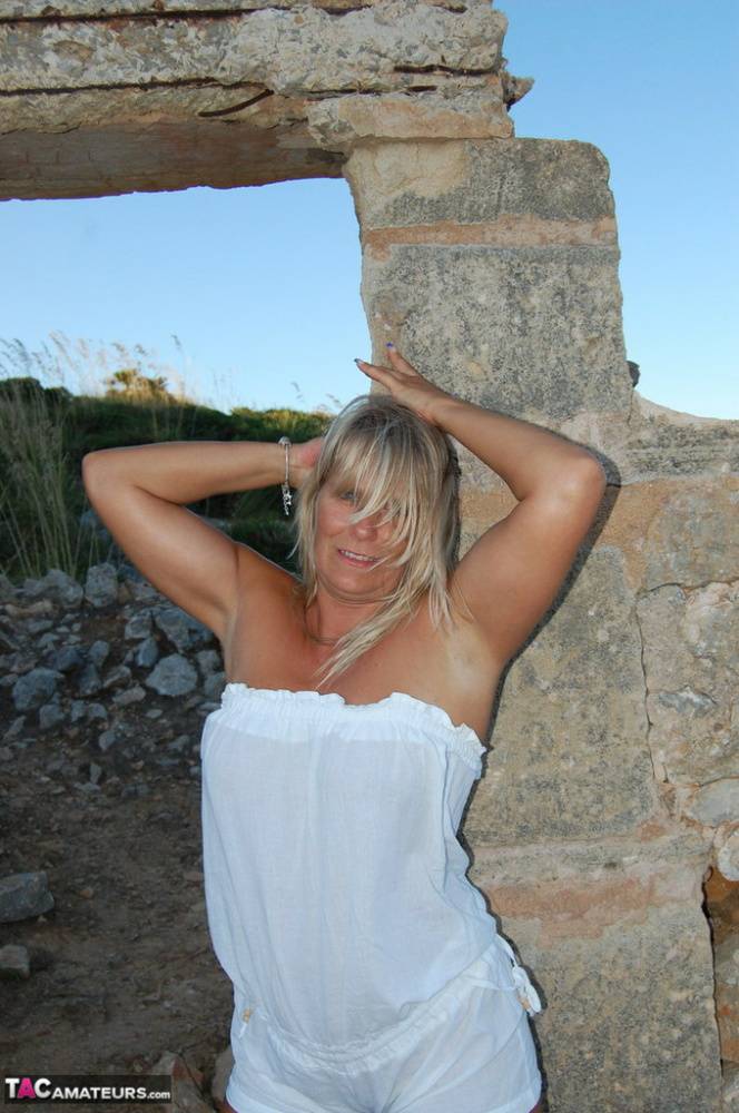 Mature blonde Sweet Susi strikes great nude poses on a construction site - #4