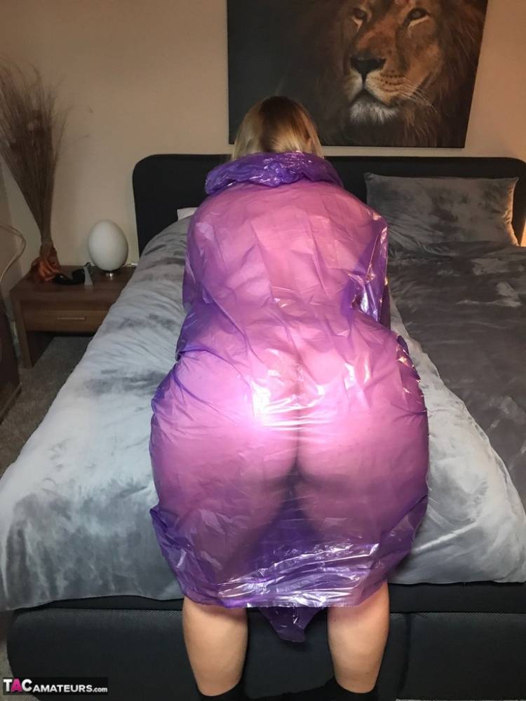 Mature amateur Sweet Susi lifts up a see-through raincoat to show her snatch - #7