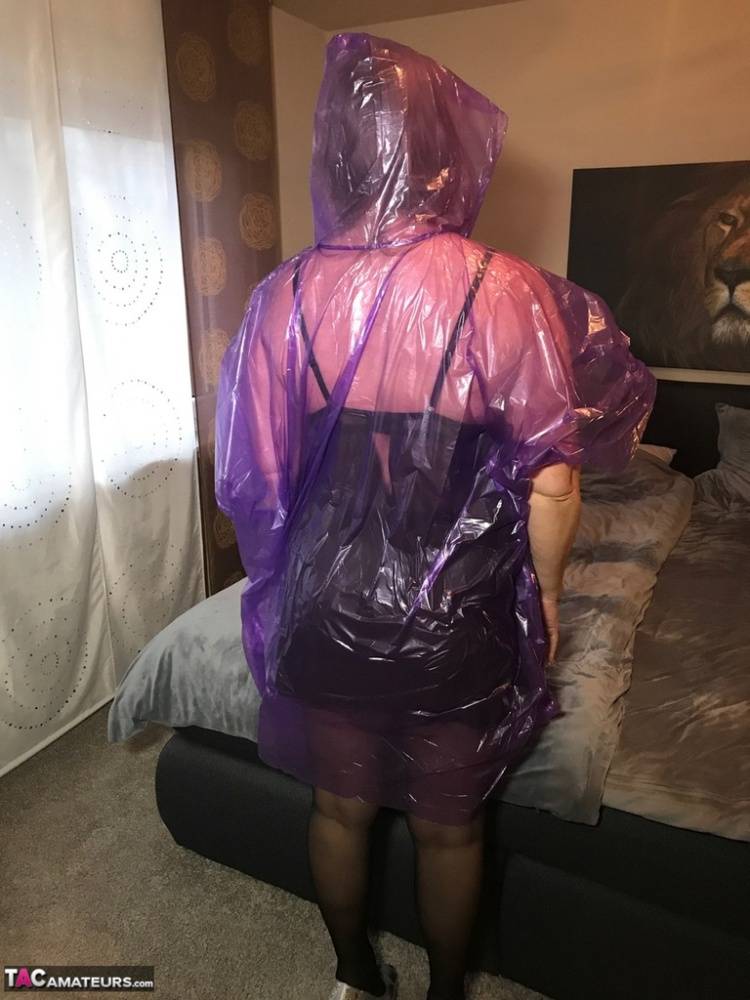 Mature amateur Sweet Susi lifts up a see-through raincoat to show her snatch - #6