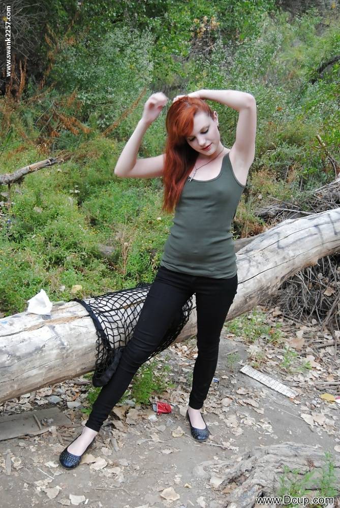 Young redhead chick Nicci Vice showing off tits and ass in the woods - #5