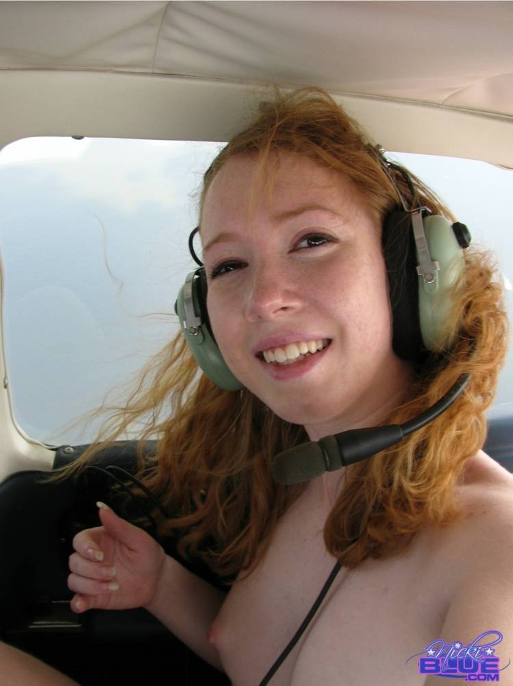 Natural redhead Nicki Blue gets totally naked aboard a small engine aircraft - #15