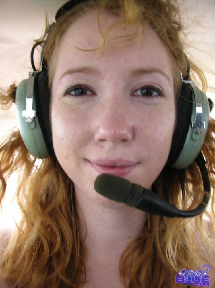 Natural redhead Nicki Blue gets totally naked aboard a small engine aircraft - #10