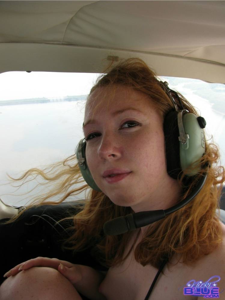 Natural redhead Nicki Blue gets totally naked aboard a small engine aircraft - #12