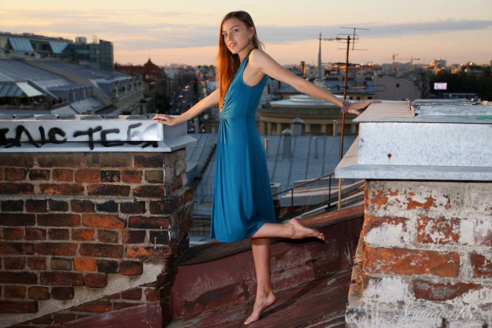 Pretty 18 year old Sofy B gets totally naked on the roof of a building - #11