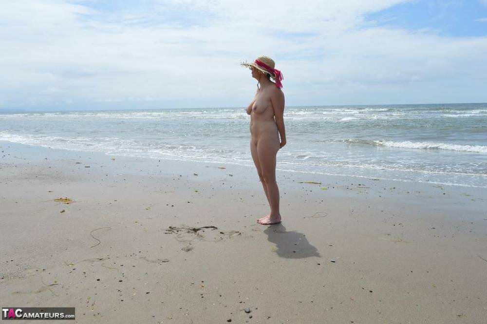 Older amateur Barby Slut wades into the ocean in nothing more than a sun hat - #5