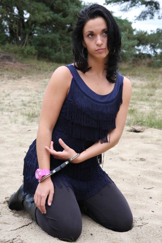 Brunette girl Nora is handcuffed to a tree while wearing a pink G-Shock watch - #16