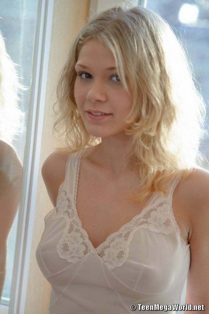 Sexy blonde teen Valya removes white lingerie in front of a window - #7