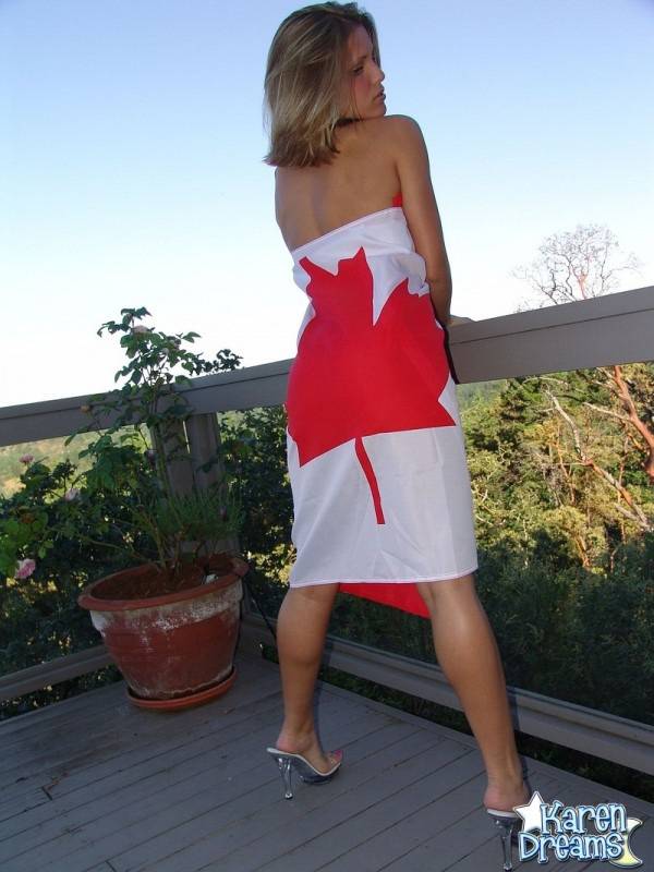 Young amateur Karen wraps her naked body in a Canadian flag on a deck - #4