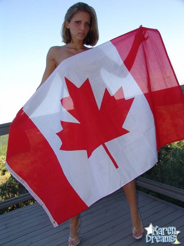 Young amateur Karen wraps her naked body in a Canadian flag on a deck - #6