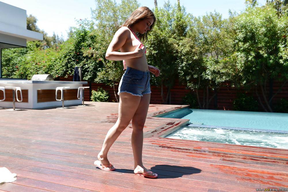Leggy teen babe Kylie Quinn strips off shorts and bikini outdoors by pool - #16