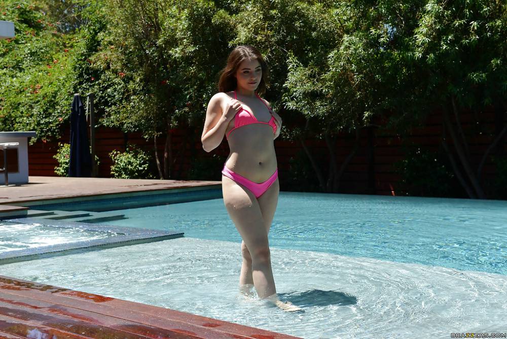 Leggy teen babe Kylie Quinn strips off shorts and bikini outdoors by pool - #7