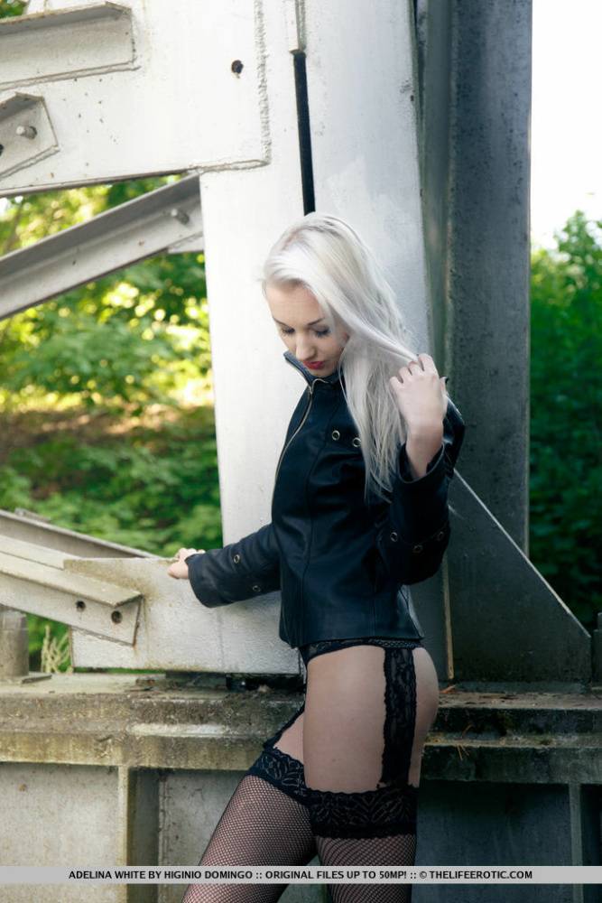 European teen Adelina White takes a pee on trestle bridge in black stockings - #8