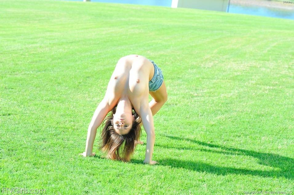 Flexible teen performs topless gymnastics at a park before going naked indoors - #1
