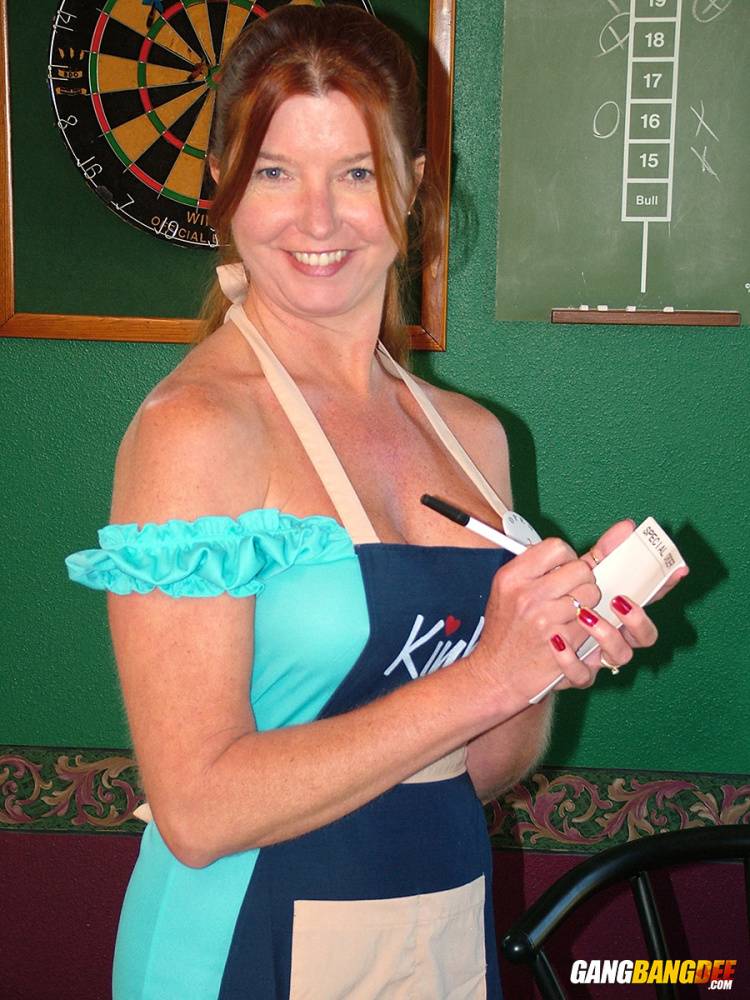 Mature lady Dee Delmar goes topless while waiting tables in a pub - #11