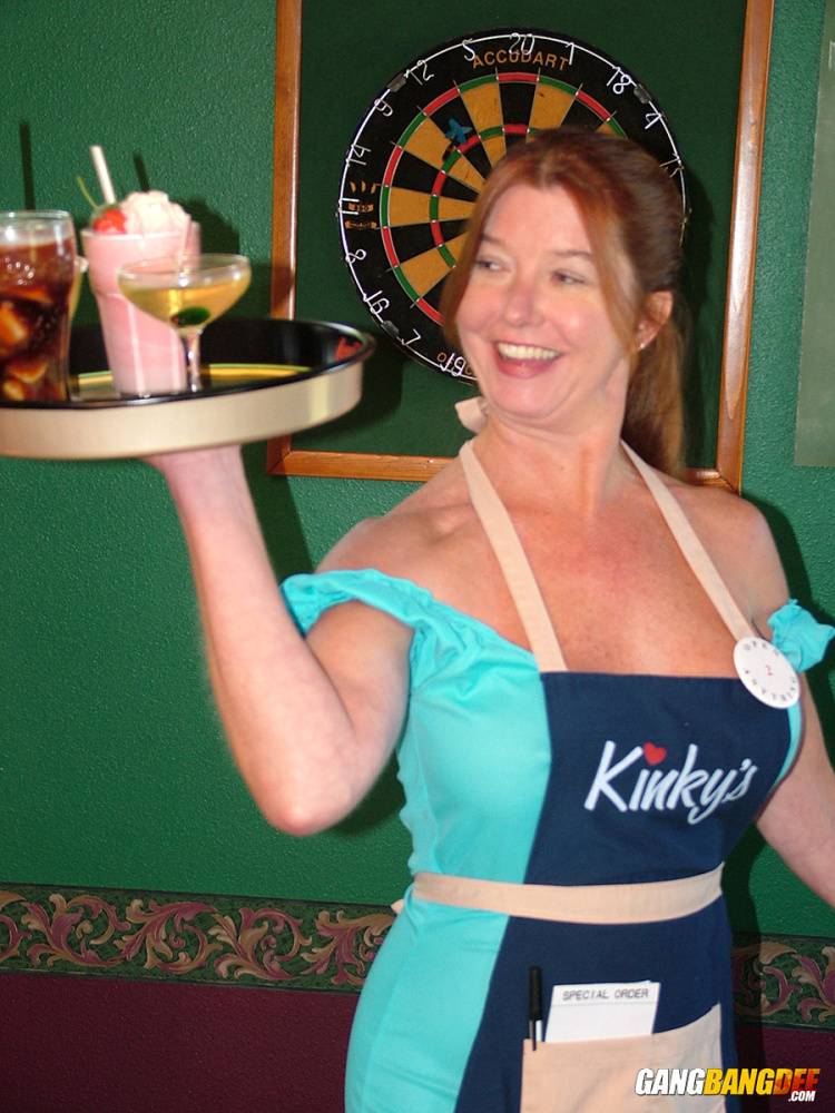 Mature lady Dee Delmar goes topless while waiting tables in a pub - #14