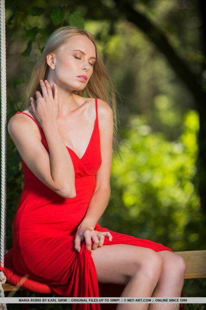 Beautiful blonde teen Maria Rubio removes a red dress to go nude on a swing - #9