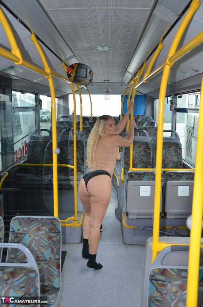 Thick blond chick takes off her underwear to pose naked in socks on a city bus - #3