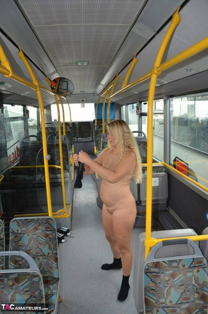 Thick blond chick takes off her underwear to pose naked in socks on a city bus - #5