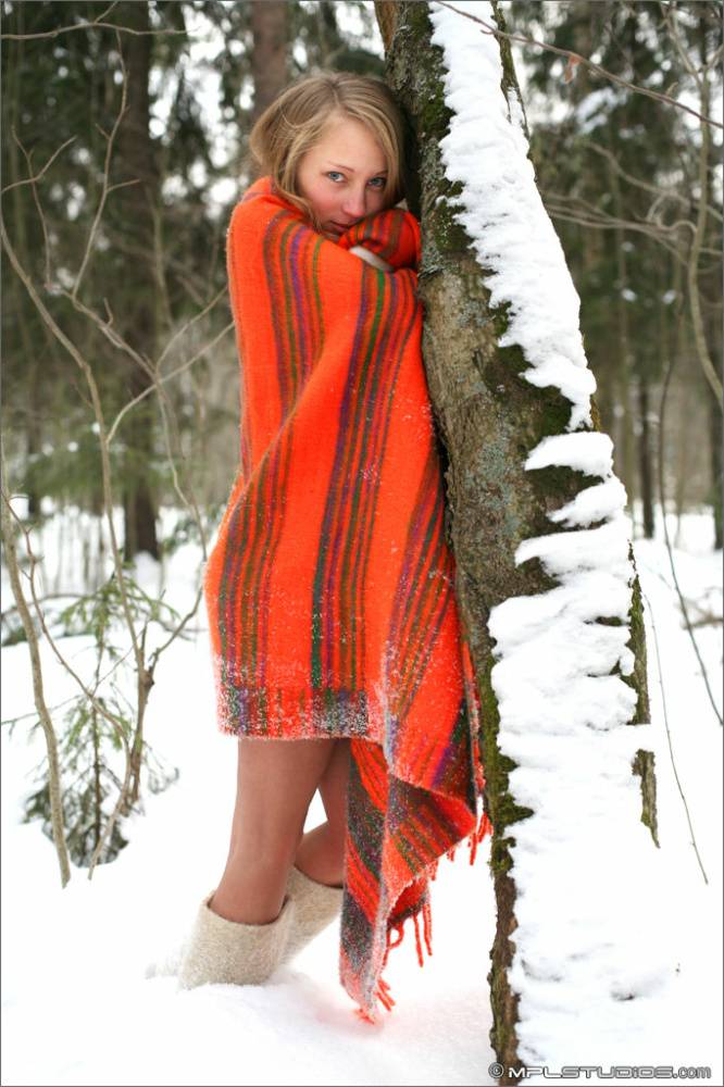Slender hot redhead playing in the cold snow with hard nipples in a blanket - #11