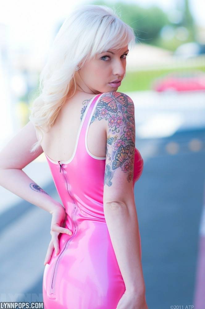 Amateur model Lynn Pops struts in parking lot wearing a pink latex dress - #10